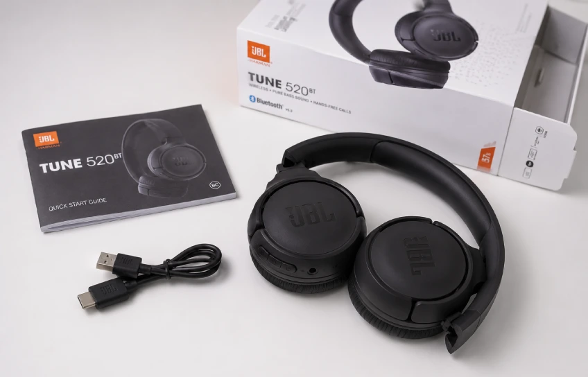 JBL Tune 520BT unboxing with headphones, charging cable, and quick start guide