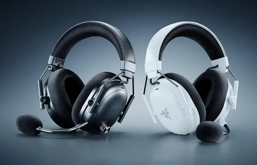 Black and white Razer BlackShark V3 Pro headsets facing each other, showing the detachable boom microphone on each
